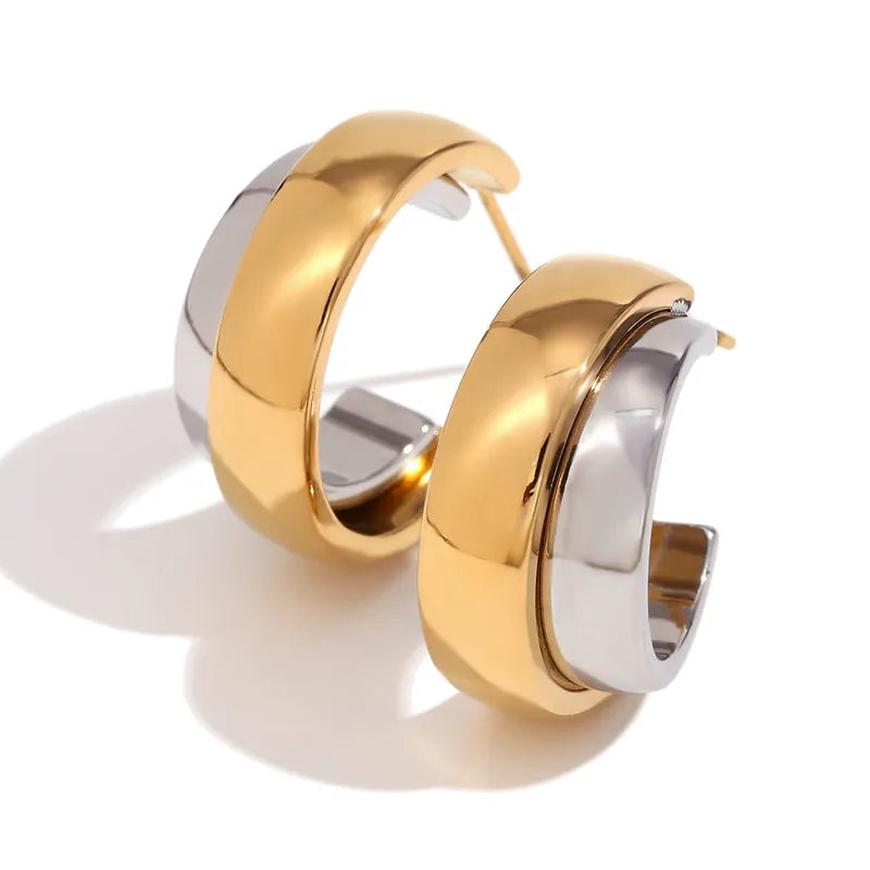 Statement Wave Oorringen — Goud & Zilver