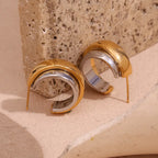 Statement Wave Oorringen — Goud & Zilver