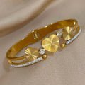 Elegante RVS Bangle Armband – Triple Gold Hearts & Strass
